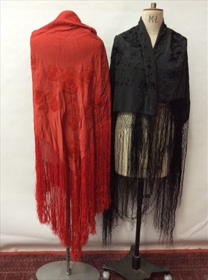 Lot 1664 - Victorian black embroidered silk shawl with fringing, c1930s embroidered red shawl, cream woven wool and tiny mirror-work wrap, Indian silk crepe woven paisley wrap and a cream pashmina