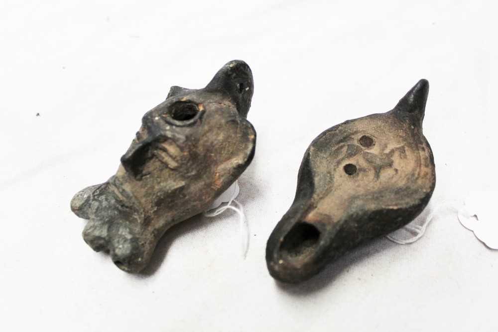Lot 77 - Two Roman-style pottery oil lamps, one modelled with a bearded face