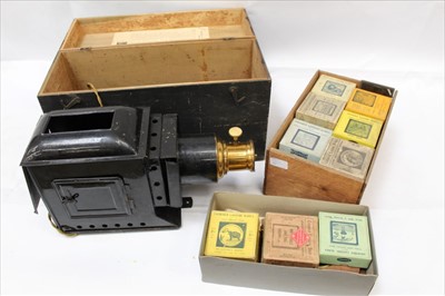 Lot 1937 - Cased Optimus magic lantern and a collection of antique glass slides, mostly boxed