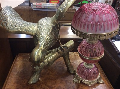 Lot 483 - Large brass eagle together with a pink coloured glass lamp