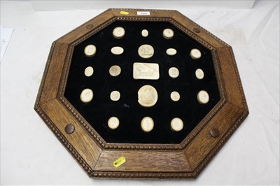 Lot 1916 - Group of Grand Tour plaster intaglios mounted in a later octagonal oak frame