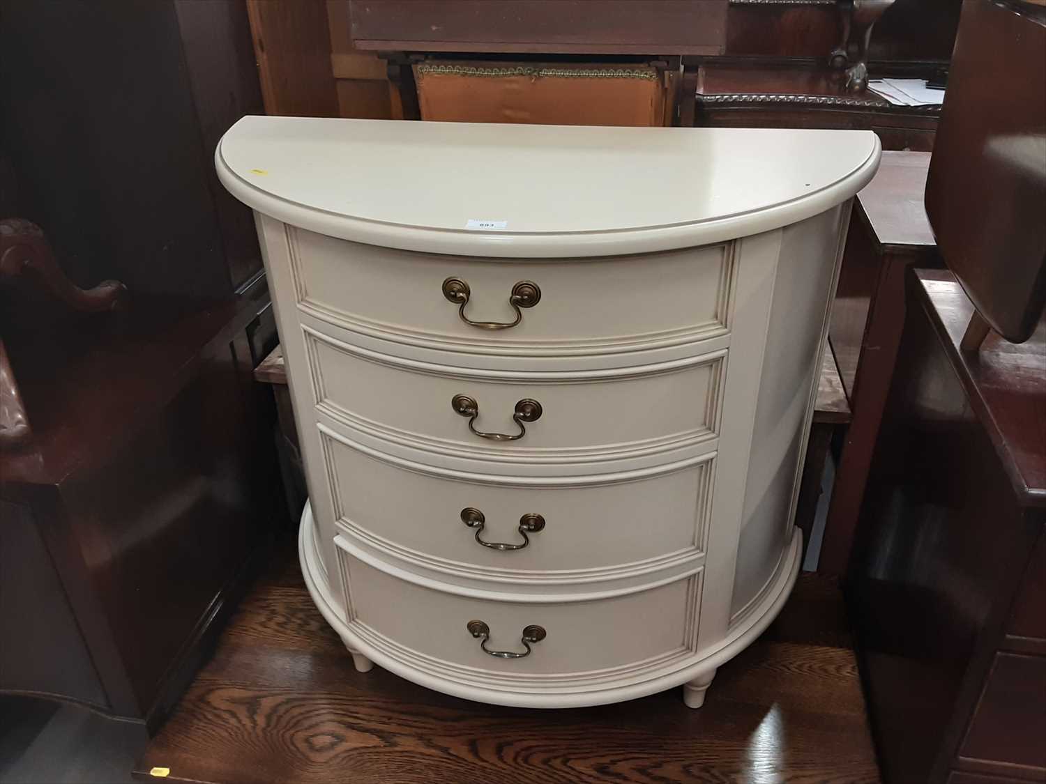 Cream Drawers Lot 893 - Contemporary cream chest of four drawers