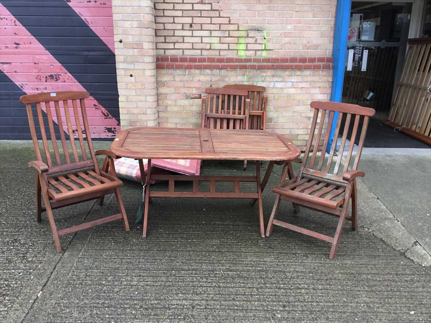 Lot 1067 Garden dining table and set of four chairs