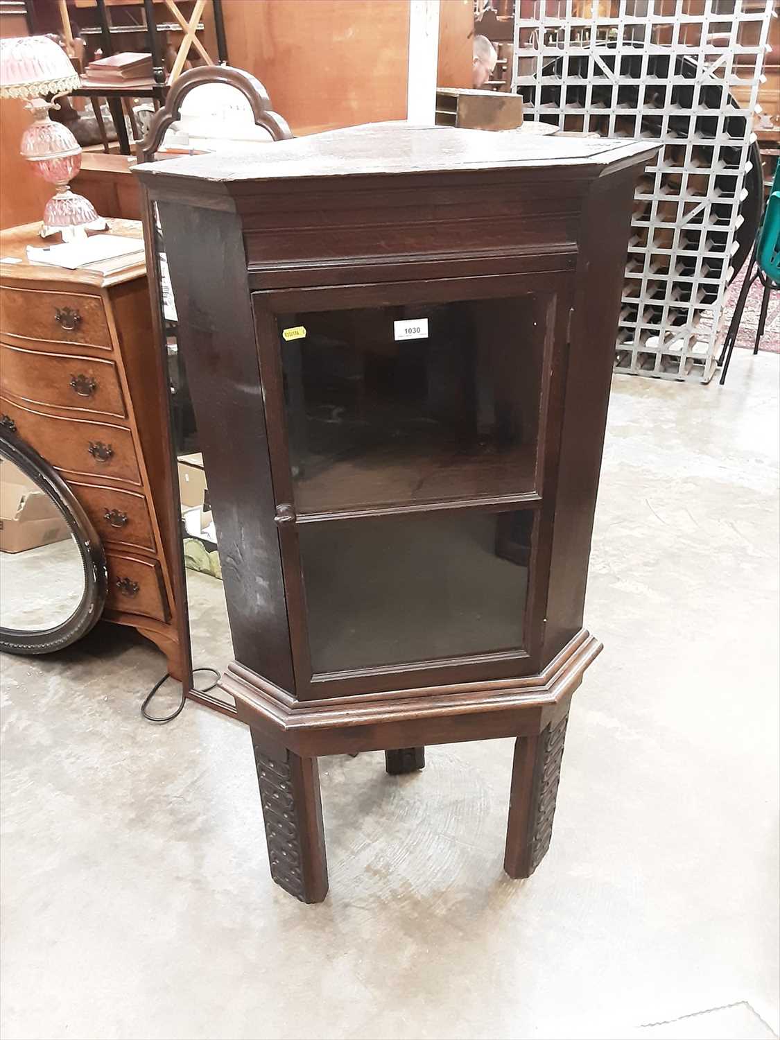 Lot 1030 - Stained oak corner cupboard with glazed door