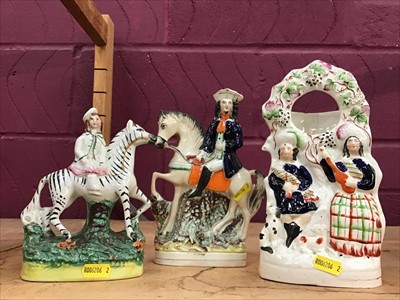 Lot 555 - Three 19th Century Staffordshire pottery figures including a Zebra