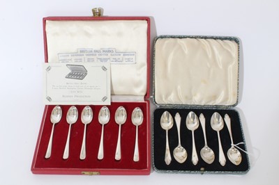 Lot 231 - Two cased sets of six silver coffee spoons.