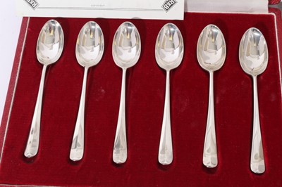 Lot 231 - Two cased sets of six silver coffee spoons.