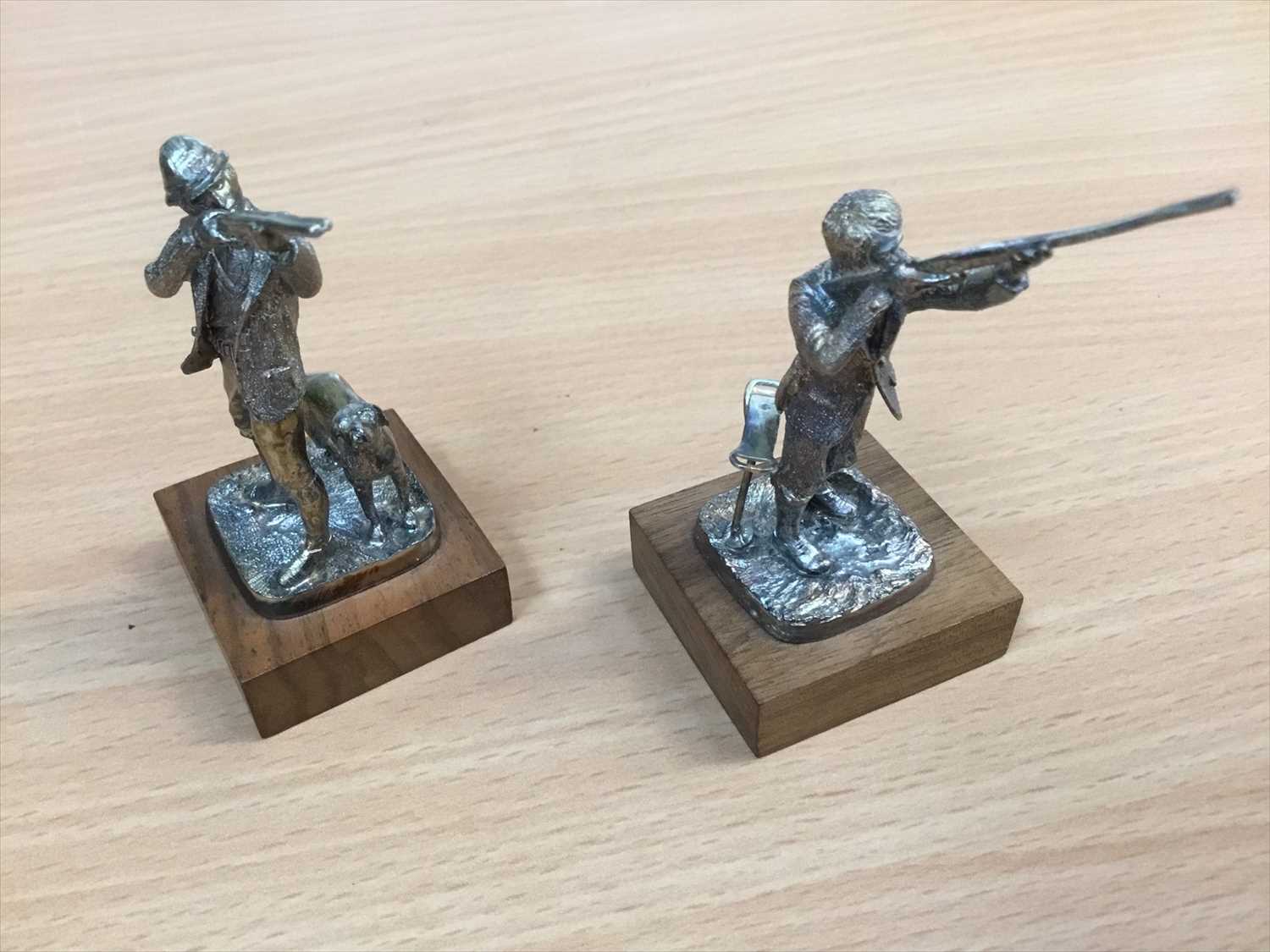 Silver Models Collect Lot 667 - Pair of silver models of men shooting