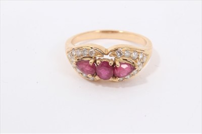Lot 121 - Ruby and diamond ring with three rubies surrounded by brilliant cut diamonds