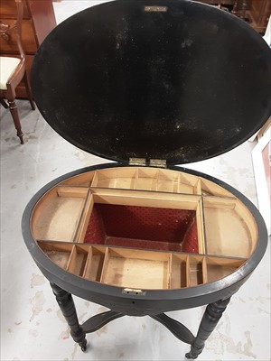 Lot 1027 - Victorian ebonised and burr walnut oval sewing table on ring turned legs joined by stretchers