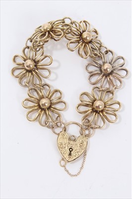 Lot 125 - 9ct gold bracelet with six large gold daisy head panels and padlock clasp