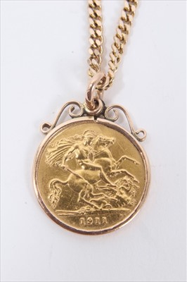 Lot 130 - George V gold half sovereign, 1911, in pendant mount on 9ct gold chain