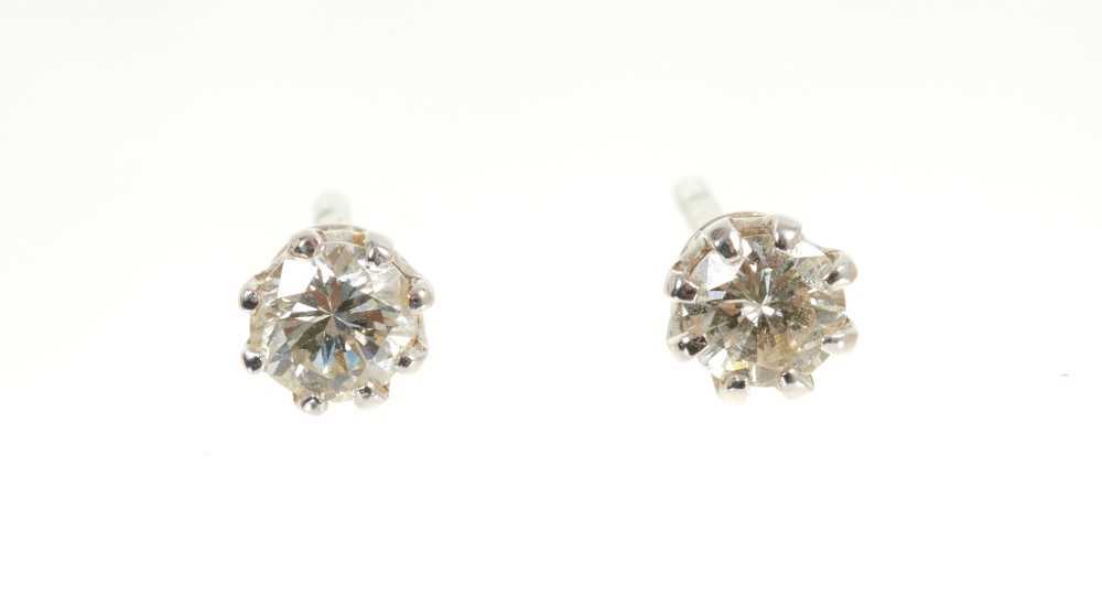 Lot 439 - Pair of diamond single stone earrings estimated total diamond weight approximately 0.50cts