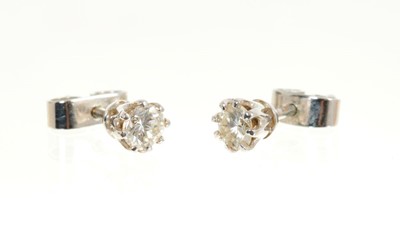 Lot 439 - Pair of diamond single stone earrings estimated total diamond weight approximately 0.50cts