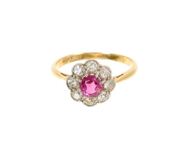 Lot 442 - Ruby and diamond cluster ring with a flower head cluster centred with a round mixed cut ruby surrounded by eight old cut and brilliant cut diamonds in mille grain setting on 18ct yellow gold shank