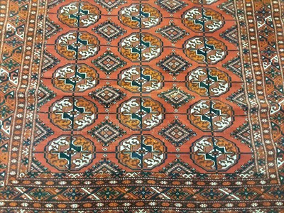 Lot 1072 - Eastern rug with geometric decoration on red ground