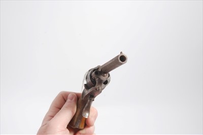 Lot 823 - Antique Pin Fire Revolver with wood grip