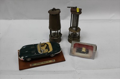 Lot 1962 - Brass Miners lamp by The Protector Lamp & Lighting Co Ltd, together with another Miners lamp and two model cars