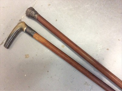 Lot 117 - Silver topped walking stick and horn handled stick with silver collar