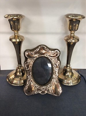 Lot 664 - Pair of silver candlesticks, and silver photograph frame