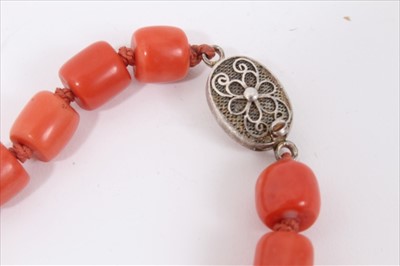 Lot 2 - Old Chinese coral necklace with barrel shaped polished beads and oval silver clasp