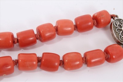 Lot 2 - Old Chinese coral necklace with barrel shaped polished beads and oval silver clasp