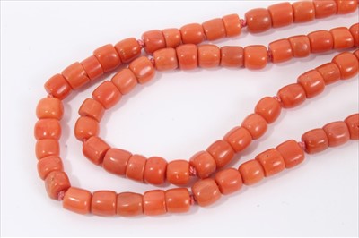Lot 3 - Old Chinese coral necklace, six of the barrel beads flanked by blue enamel flowers terminating with a double row of coral beads and an oval silver clasp