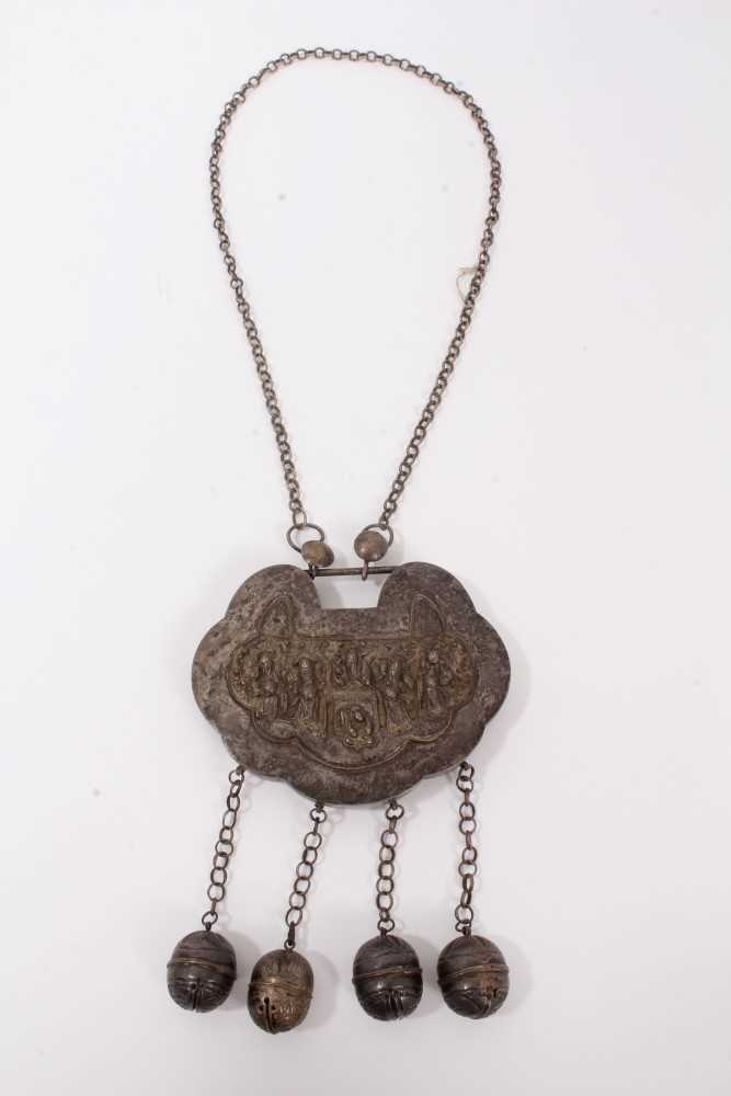 Lot 4 - Old Chinese white metal necklace with embossed panel depicting figures and Chinese characters, with chain and bells