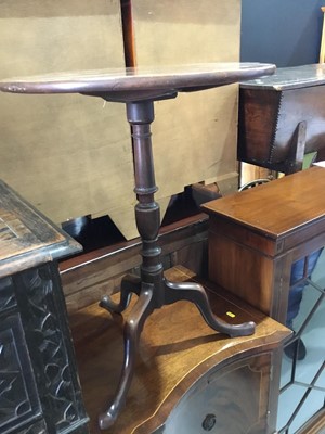 Lot 143 - George III mahogany tilt top wine table, with turned column support on tripod base, 53 x 68cm