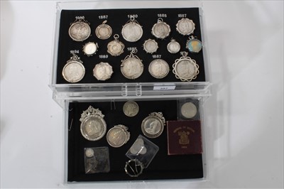 Lot 397 - G.B. A two drawer display cabinet housing a collection of Victoria J.H. and O.H. silver coins and medallions (N.B. all within silver pendants) & others