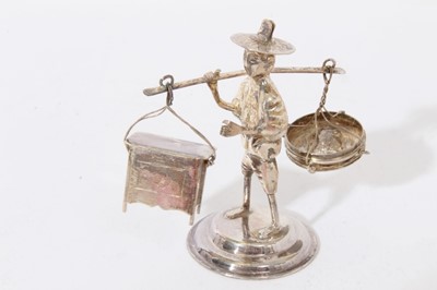 Lot 227 - Four Contemporary Far Eastern silver figures in the form of various tradesmen.