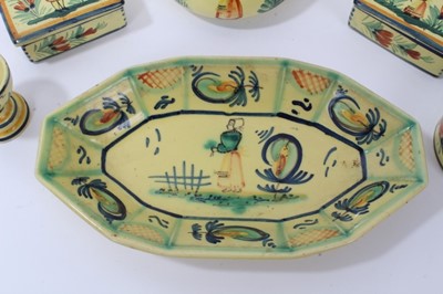 Lot 86 - Collection of Quimper faience pottery, painted with figures and foliate patterns on a yellow ground, including a teapot, egg cup, boxes, dish and a ramekin, all marked