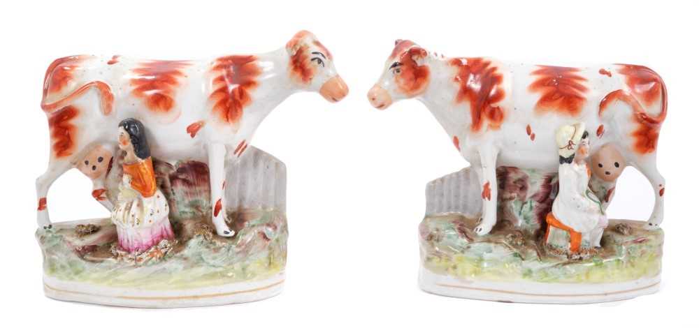 Lot 88 - Pair Staffordshire pottery cow and milkmaid groups circa 1870