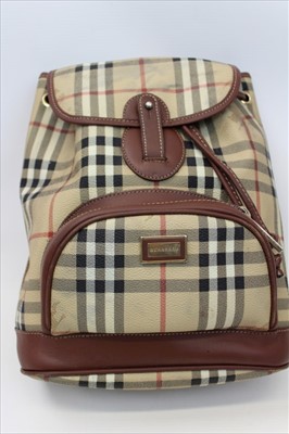 Lot 1705 - Burberry check leather rucksack with top stitched leather trims, adjustable fabric shoulder straps, press stud and draw string closure