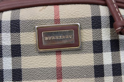 Lot 1705 - Burberry check leather rucksack with top stitched leather trims, adjustable fabric shoulder straps, press stud and draw string closure