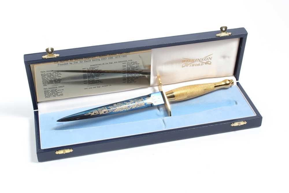 Lot 796 - Fine Wilkinson Sword commemorative Commando dagger with gilded hilt, blue and gilt blade 'The Special Air Service Regiment Golden Jubilee 1941 - 1991', in fitted case with plaque