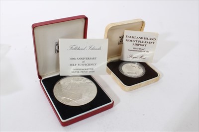 Lot 438 - Falklands - The Royal Mint issued silver proof coins to include £25 '100 years of Self Sufficiency' 1985 (weight 155.8 gm) and fifty pence 'Mount Pleasant Airport' 1985 (both cased with Certificat...