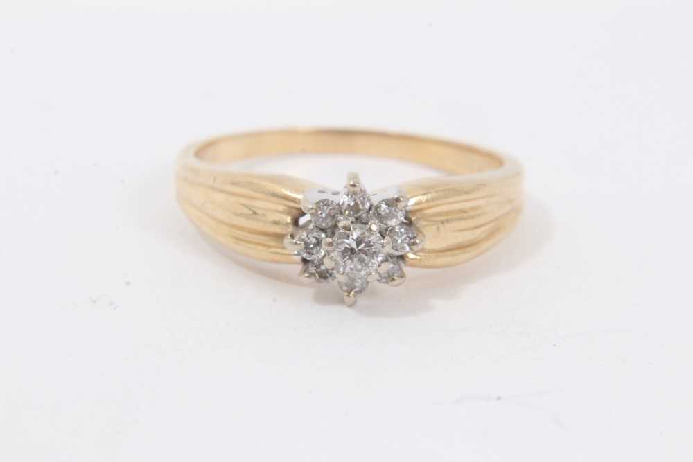 Lot 201 - 14ct gold diamond flower head cluster ring