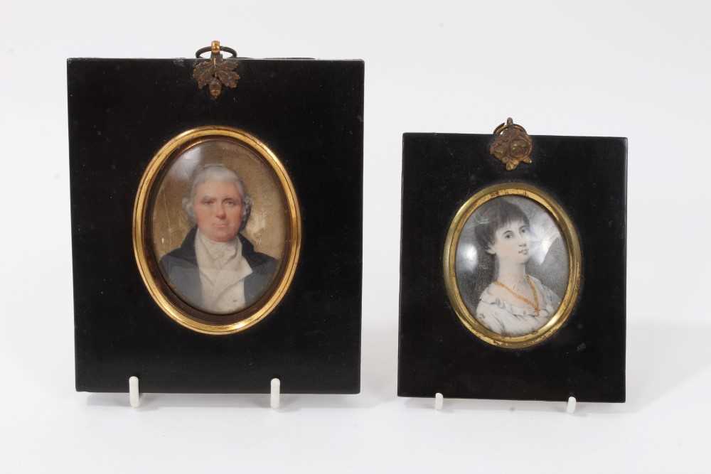 Lot 709 - George III portrait miniature on ivory, together with another portrait miniature