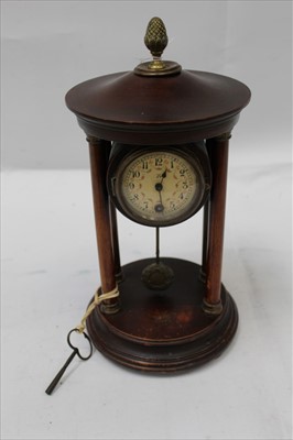 Lot 1945 - Early 20th Century French mantel clock supported by four pillars with pendulum below