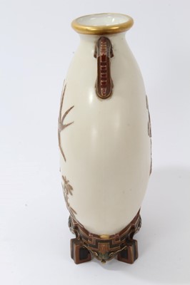 Lot 168 - Victorian Royal Worcester porcelain Aesthetic movement ‘Japanese’ moonflask vase after Christopher Dresser, with raised gilt and polychrome bird, insect and floral decoration, raised on architectur...