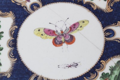 Lot 78 - Worcester plate, circa 1770, decorated with exotic birds and insects on a blue scale and gilt ground, and a similar Worcester oval dish