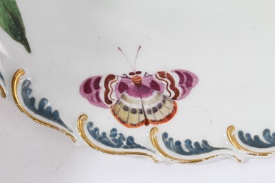 Lot 128 - Chelsea oval dish painted with fruits, butterflies, and leaves, circa 1760