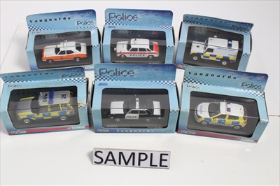 Lot 1408 - Diecast selection of police vehicles in four boxes, manufacturers including Corgi, Dinky, Lledo, Vanguards etc (qty)