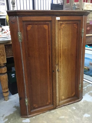 Lot 1016 - George III inlaid mahogany corner cupboard