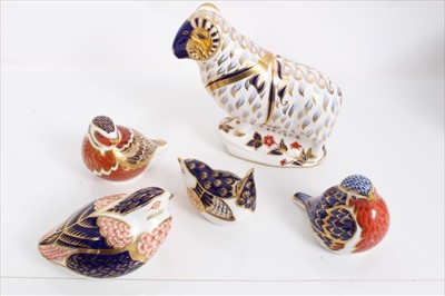 Lot 1001 - Five Royal Crown Derby porcelain paperweights to include a Ram, and four birds