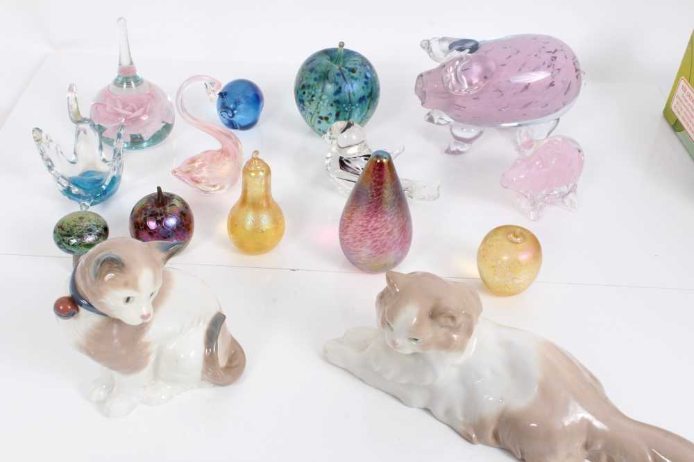 Lot 1002 - Three Nao porcelain cats and a collection of 13 glass paperweights including Isle of Wight and Alum Bay