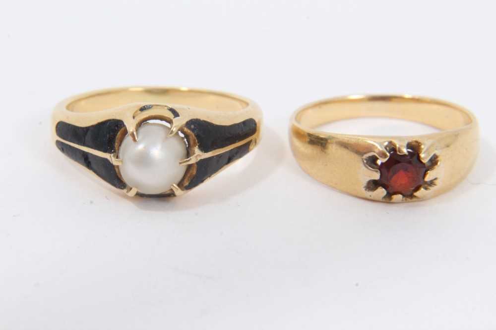 Lot 176 - Victorian gold pearl and black enamel mourning ring and a yellow metal ruby gypsy ring
