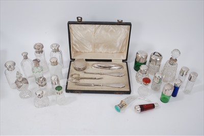 Lot 208 - Collection of silver topped glass scent bottles and 1940s five piece silver mounted vanity set in a fitted case