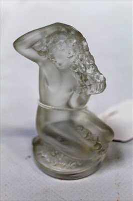 Lot 1006 - Lalique glass 'Floréal' figure of a kneeling female nude, etched signature, signed ' Lalique, France', paper label numbered 1191500, height 85mm.